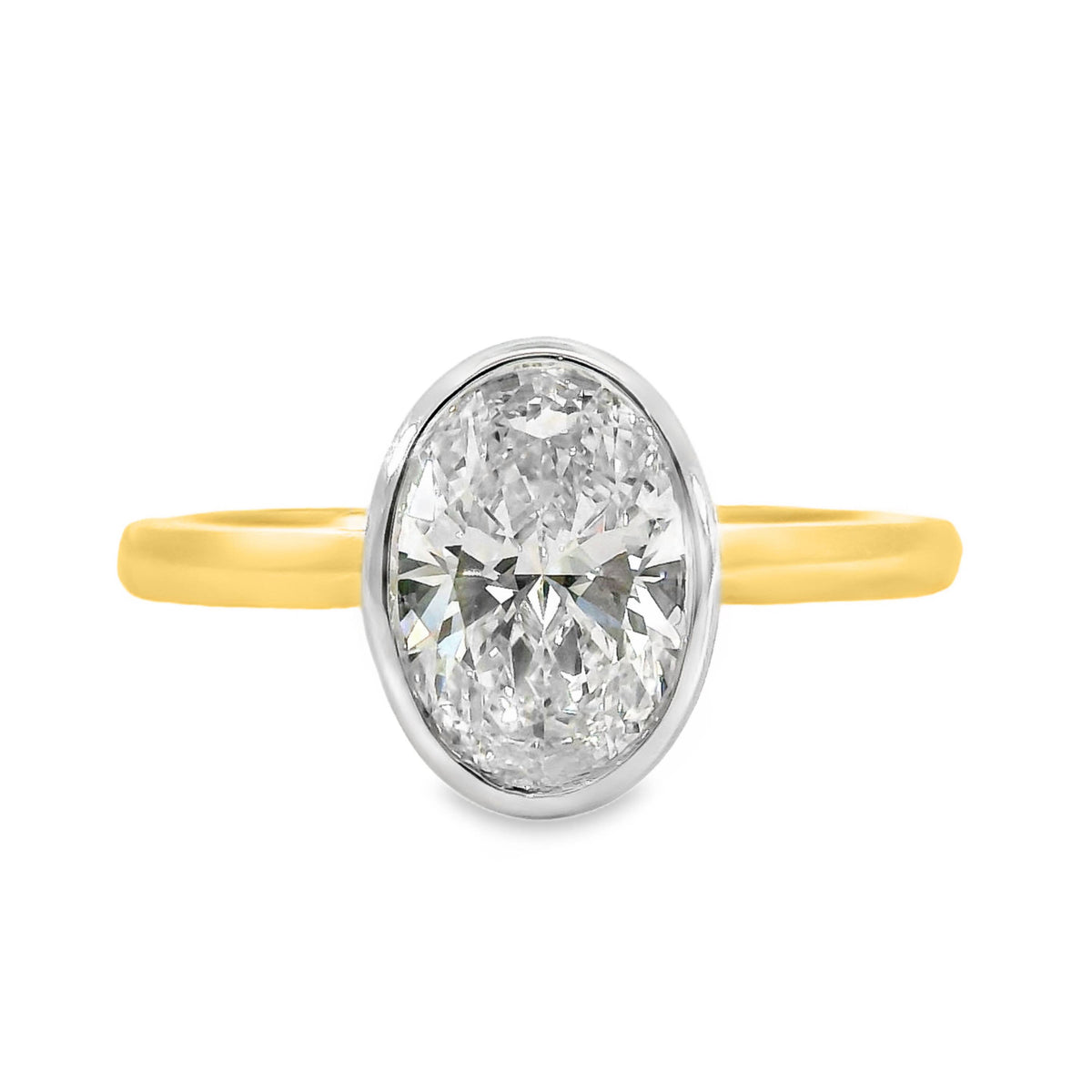 Freya 18ct Yellow And White Gold Oval Cut Bezel Set Solitaire Ring