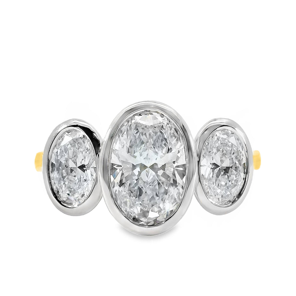 Tabitha 18ct Yellow And White Gold Oval Cut Bezel Set Trilogy Ring